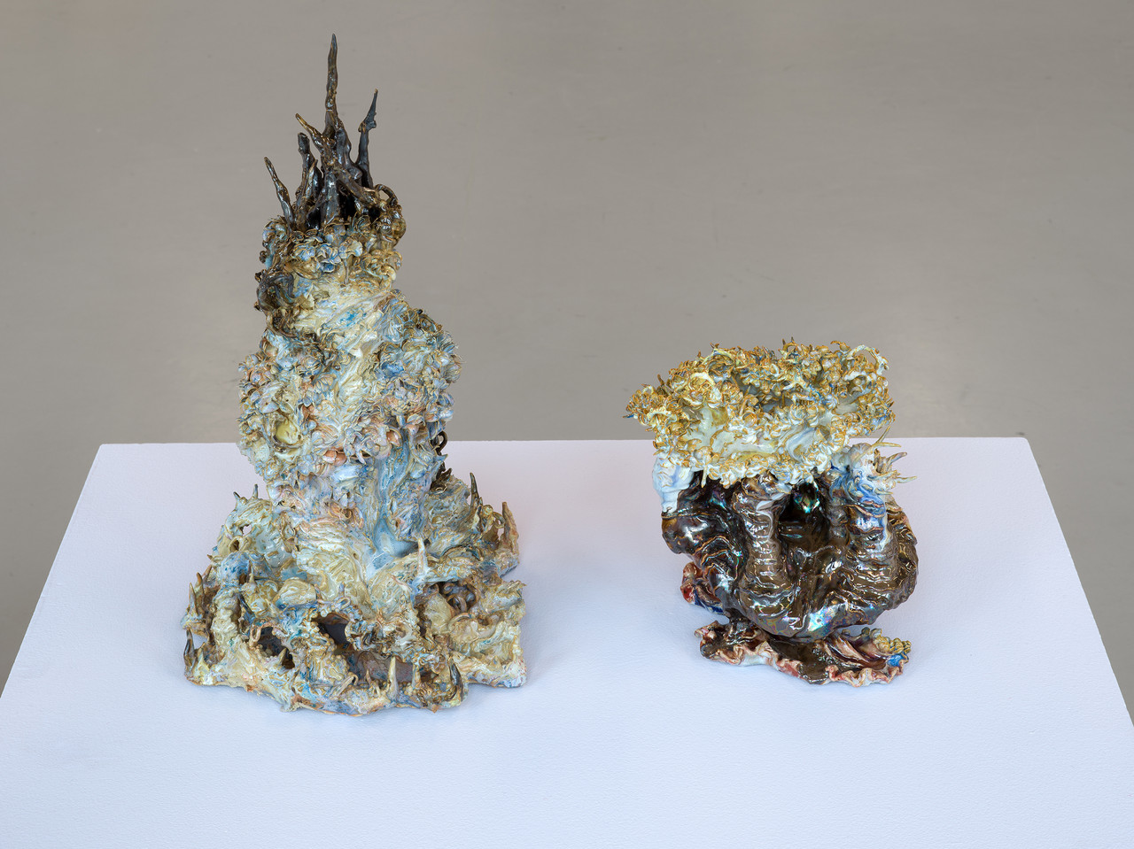 (left to right) Shellbound_II, 2025 Glazed ceramic, 30 x 20 x 18 cm Like a Wounded Organism Still Choosing to Flower, 2026 Glazed ceramic, 40 x 26 x 22 cm Dalmo, 2026 Glazed ceramic, 35 x 22 x 22 cm