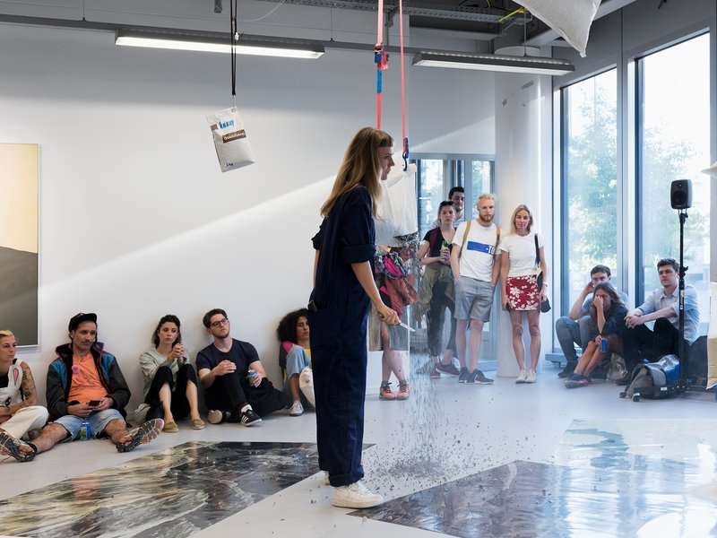 Aurélie Strumans, My glance flattened on the surface of the screen, 2018. Inkjetprints, sand, pebbles, mortar, concrete, tensioning set, Haken, hooks, video, sound. Degree Show 2018, ZHdK. Photo: Stefan Jaeggi
