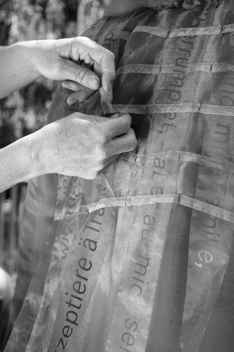 Detail of the chiffon ribbons adorning the coat.