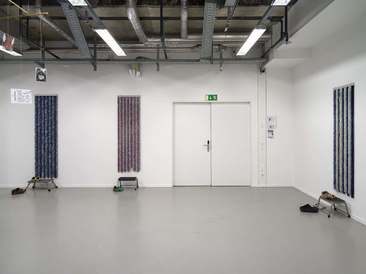 MY FATHER WAS A CLOWN 2024 Installation, Series consisting of different sets with chenille door curtains, stepping aids and shoes Variable dimensions