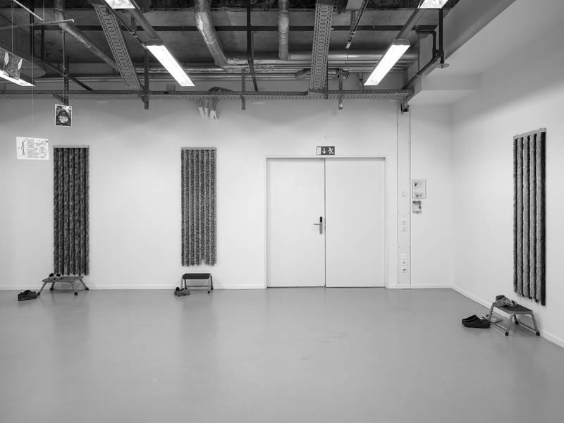 MY FATHER WAS A CLOWN 2024 Installation, Series consisting of different sets with chenille door curtains, stepping aids and shoes Variable dimensions