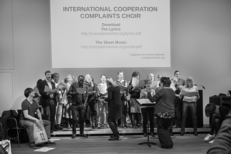 The complaints choir for international cooperation at the Art at Risk Conference, conducted by Tellervo Kalleinen (Photo: Evan Ruetsch)